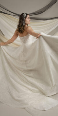 British designer wedding dress in London. Flowing bridal wear for modern bride from new exquisite collection 2024.